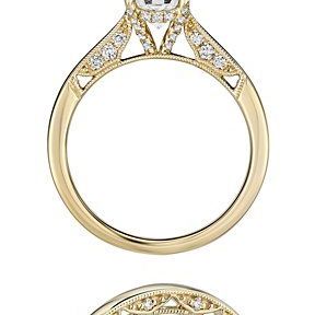 A bridal set that features intricate details on the sides of both the engagement ring and wedding band.